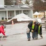 concrete finishing apprenticeship students forming concrete on the job