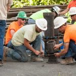 apprentices learning how to operate new tools and techniques